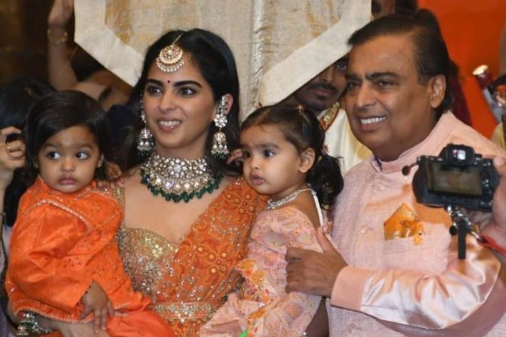 Mukesh Ambani poses with his daughter, Isha Ambani and her twins at Radhika Merchant's Mameru ceremony. (Photo: Viral Bhayani)